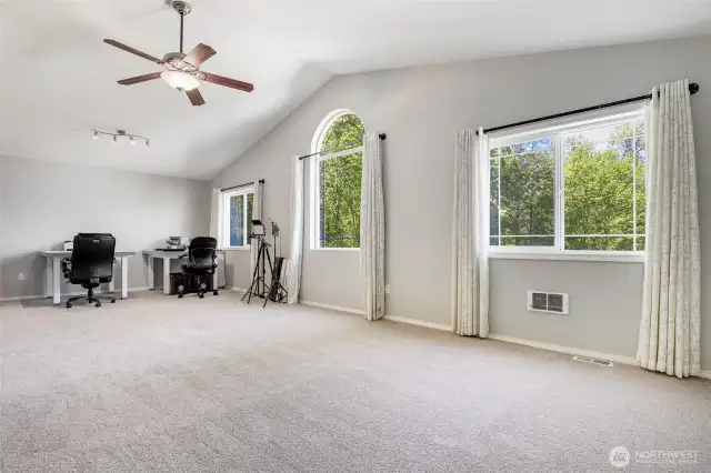 Upstairs bonus room with vaulted ceilings.