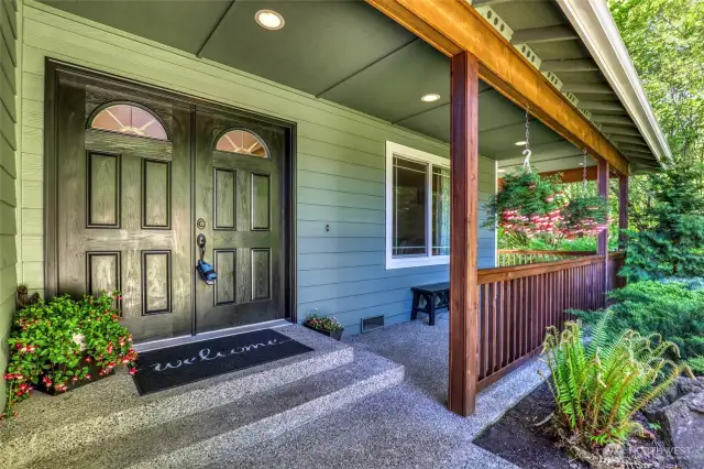 Covered porch with sitting area.