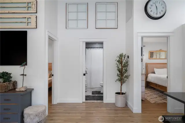 Hallway to 2 bedrooms and full bathroom straight ahead.