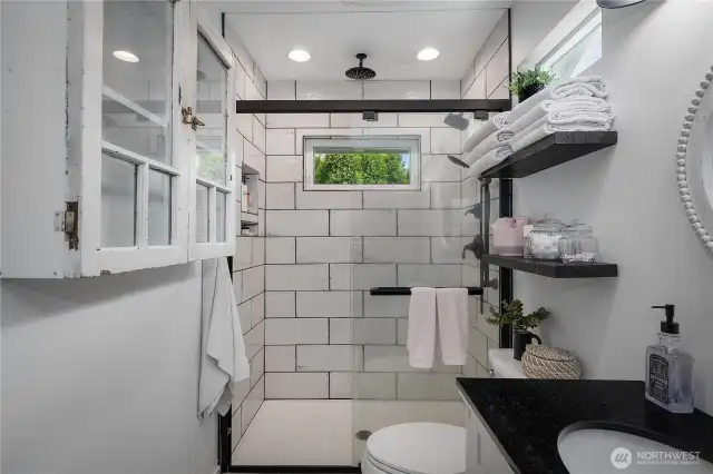 3/4 bath with fully tiled shower and quartz counter tops.
