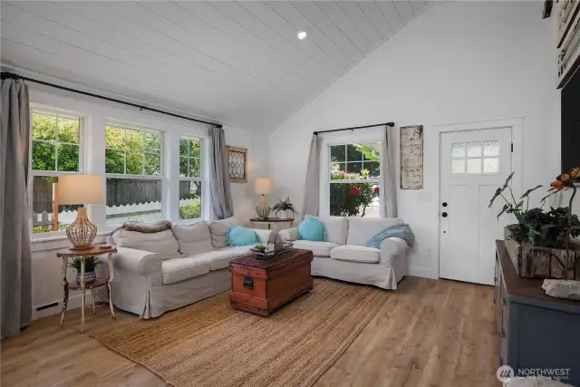 Alexa capable lighting in in the shiplap ceilings in the open living area.