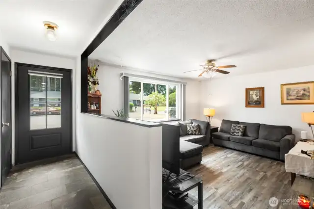 Interior entry way with storage closet and built in shelving in wall