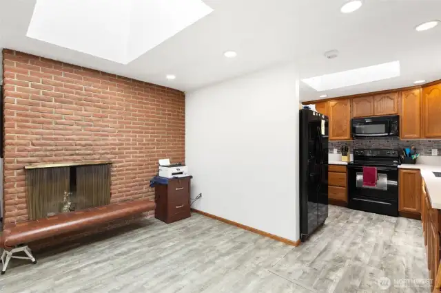 Second cozy wood burning fireplace in dining room area