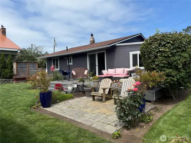 Lots of mature landscaping with beautiful roses and more!