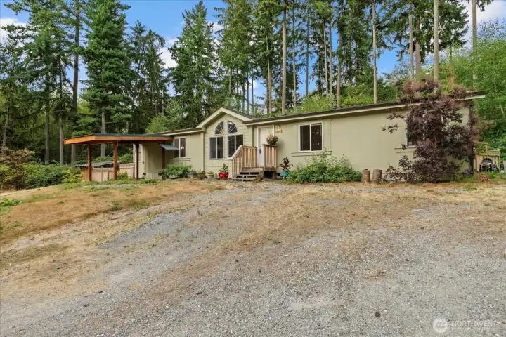 Privacy on 4.1 acres.  Room for a boat or RV to the right.