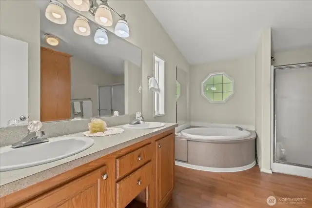 Bathroom is complete with double sinks, a soaking tum and a shower and toilet!