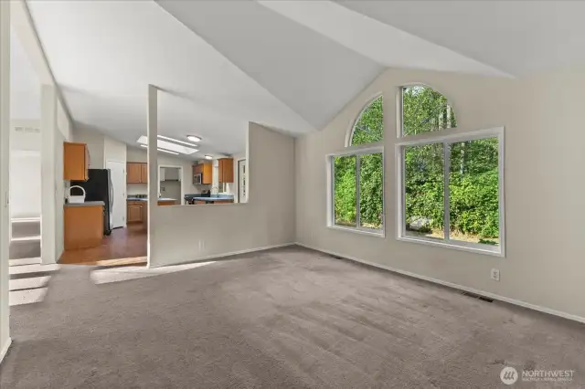 A great view of the back and easy access to the kitchen from the dining room.