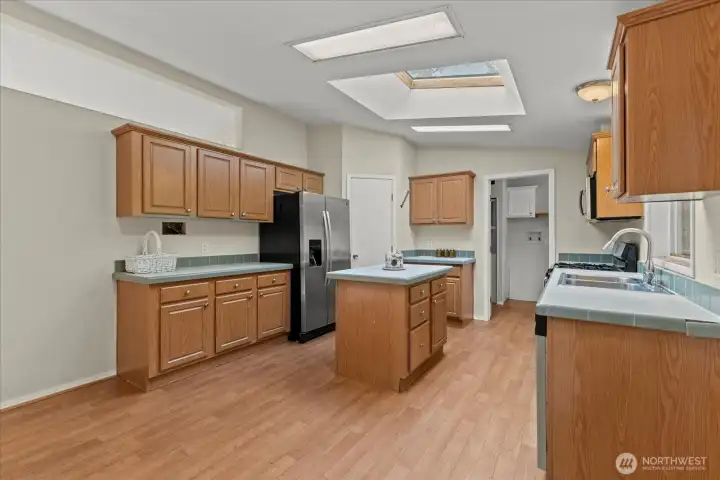 Kitchen has a large pantry in the corner.