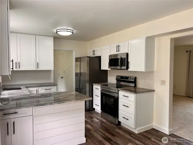 Kitchen with new cabinets and countertops and new appliances