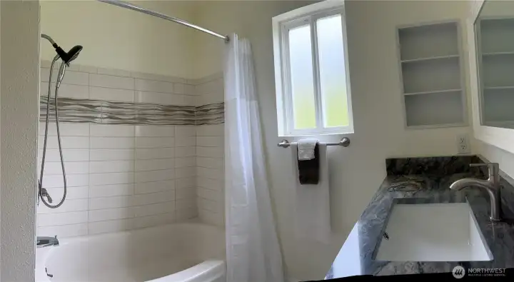 Main floor full bathroom with new cabinet & countertops