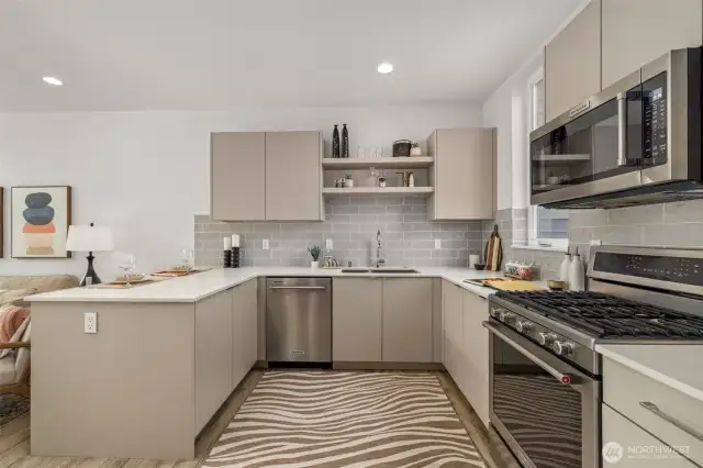 Well-appointed kitchen with stainless steel appliances and custom cabinetry