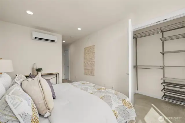 Generous closet in the primary suite complete with storage organiztion system