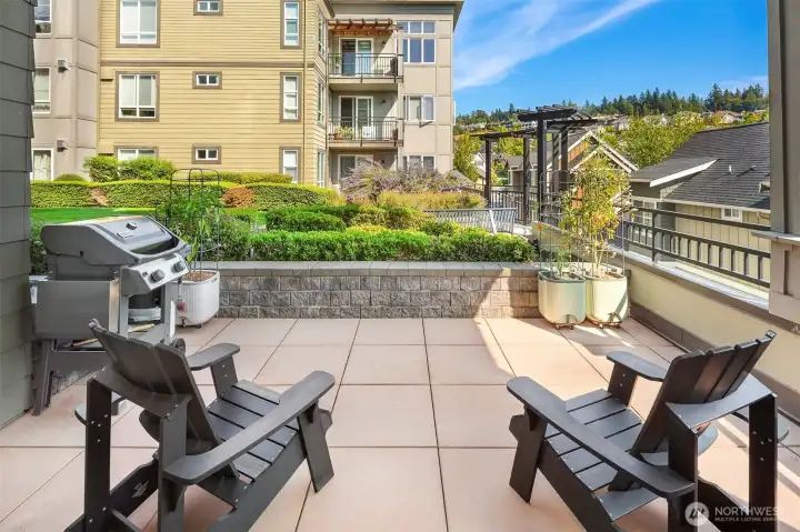 Generous patio space faces out to peaceful courtyard.
