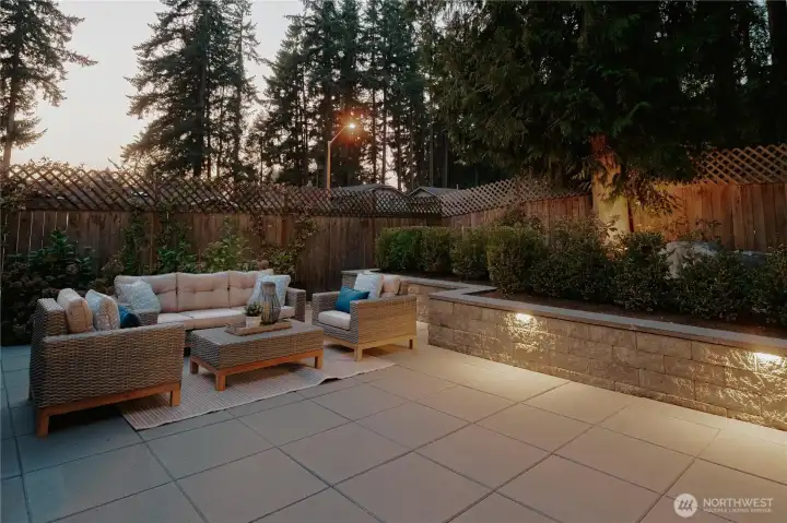 Outdoor lighting throughout backyard hardscape and landscaping