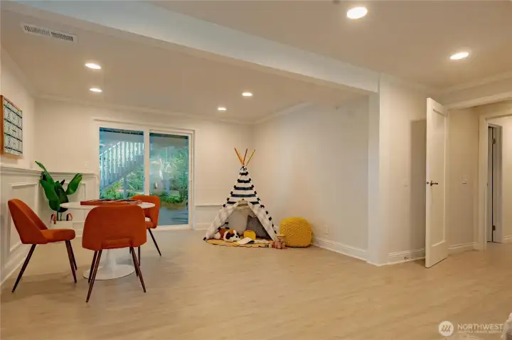 Lower level rec room showing the sliding door access to the backyard.