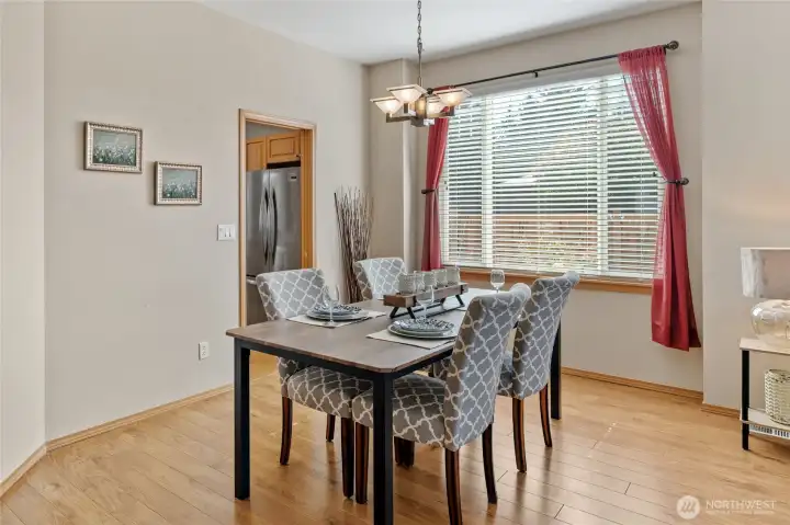 Formal dining area is steps away from the kitchen.  Window looks out your private side yard.