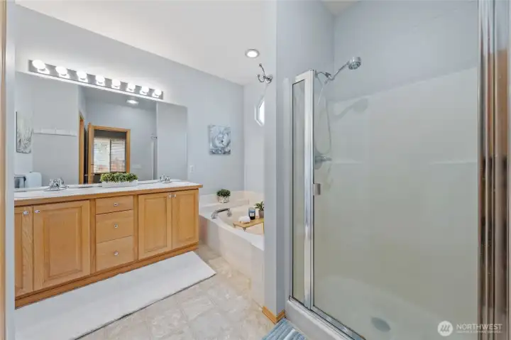 Primary en-suite with dual sinks, soaking tub, walk-in shower and separate water closet.