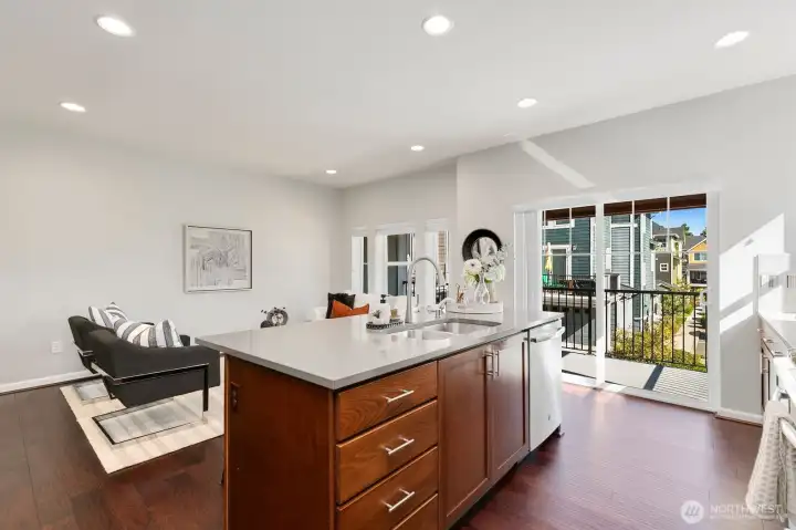 Kitchen offers slider out to covered deck.