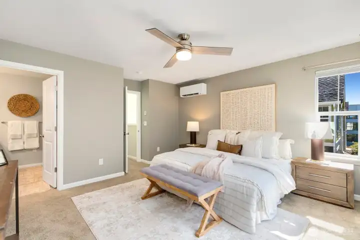 Spacious primary bedroom is on upper level.