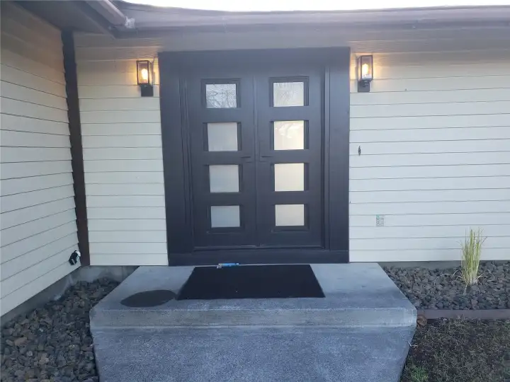 The front entry of this beautifully remodeled home just got a beautiful update to the front door.  Come on in!