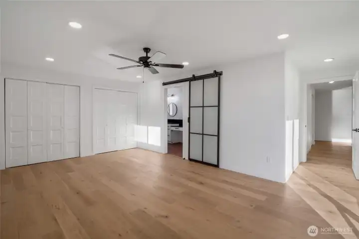 Tucked in a private corner of the home is your remodeled primary bedroom complete with full sized closets and a luxury bathroom fit for a queen!