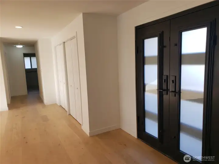 Down the hall to the bedrooms. The primary suite is to the left, and the other three bedrooms are straight ahead and spread out. (See last photo of floor plan.)