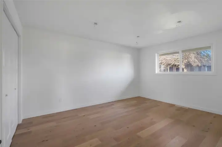 The remodeled fourth bedroom faces the right side of the house and the light fixtures are COMPLETED.