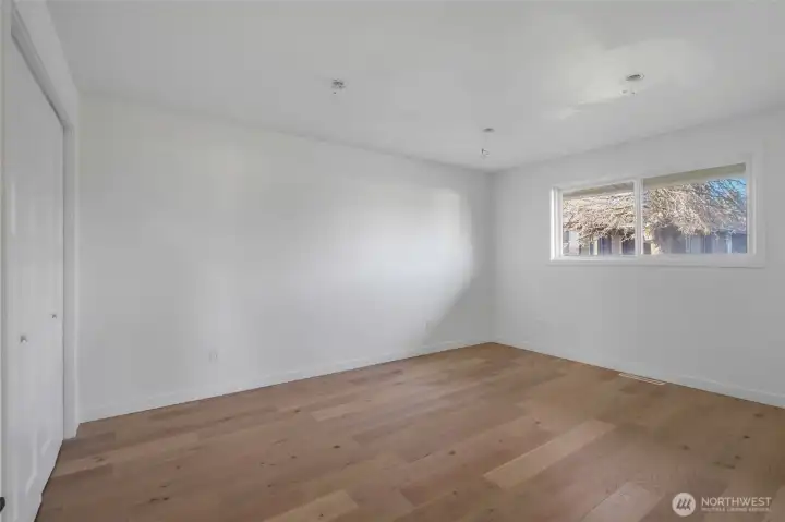 The remodeled fourth bedroom faces the right side of the house and is awaiting the final stages of electrical lighting to be installed.