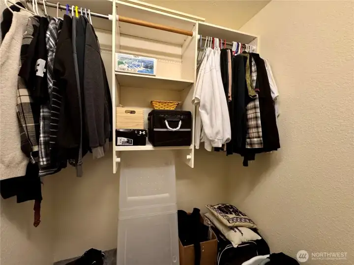Primary bedroom walk in closet.