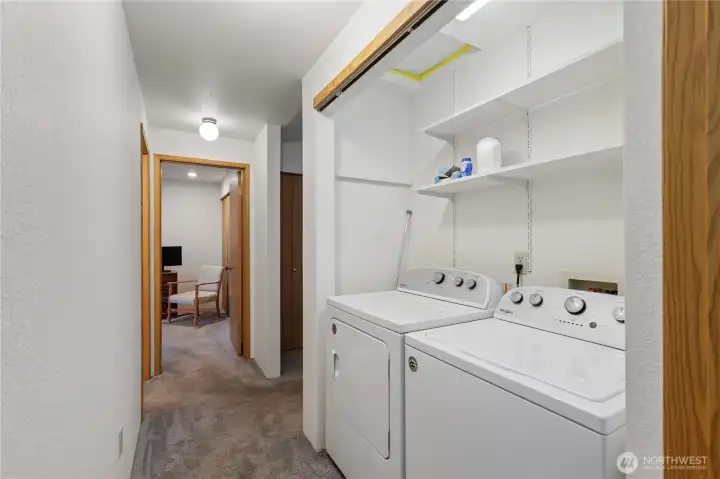 Laundry is located in the hall.