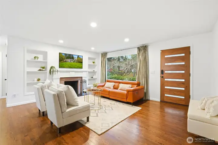Clean lines meet warm finishes, creating an immediate feeling of comfort and quiet luxury. Check out that gorgeous solid walnut front door!