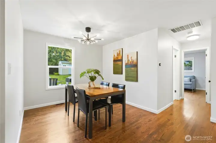 The dining space sits perfectly positioned between the kitchen and living areas, making everyday meals and entertaining feel effortless. It’s open yet defined, giving it presence without sacrificing flow.