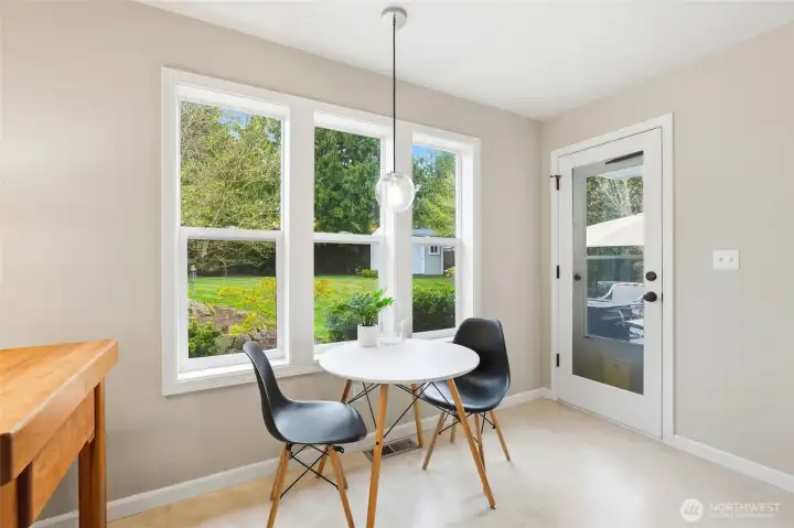 The adjoining eating area adds warmth and functionality, making it a natural everyday hub.