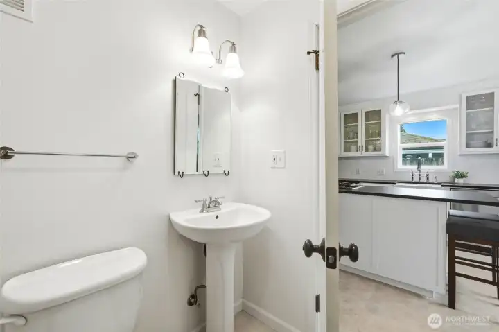 A conveniently located guest bath nearby adds to the ease of living and entertaining.