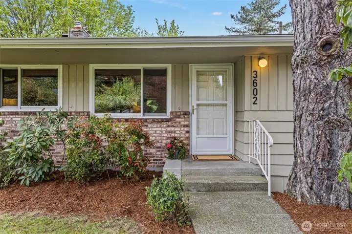 Large front yard leads to welcoming front porch. This home has been lovingly maintained throughout the years.