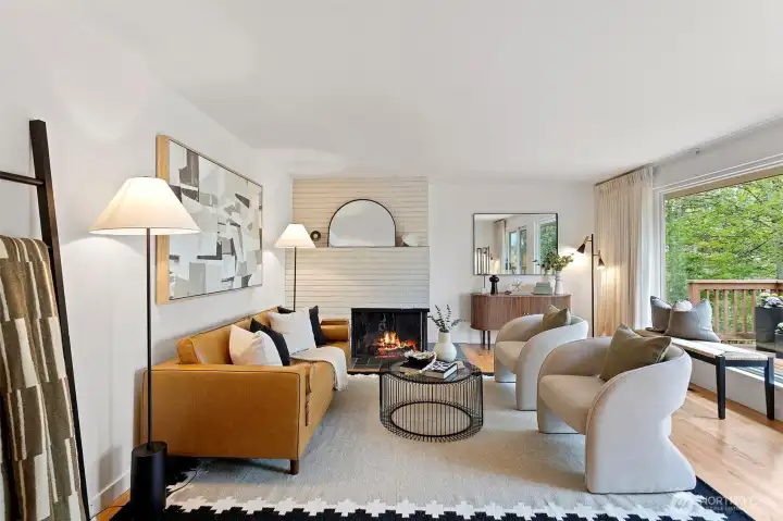 Wood burning fireplace with brick mantle surround.