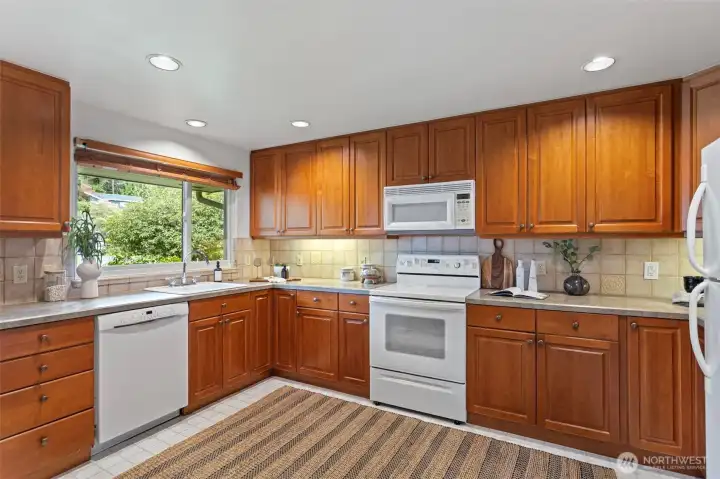 Updated windows, cherry cabinets with lots of storage.