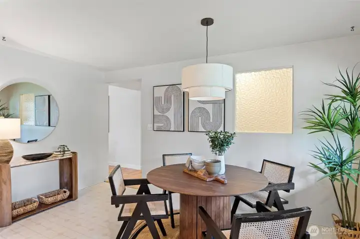 Kitchen easily accessible from entry. New drum pendant.