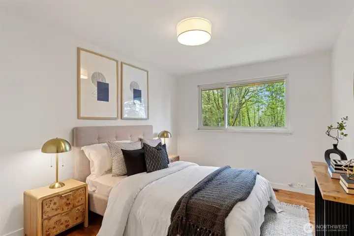 Second bedroom overlooks the backyard sanctuary.