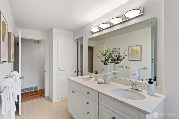 Connects to hallway and primary bedroom.