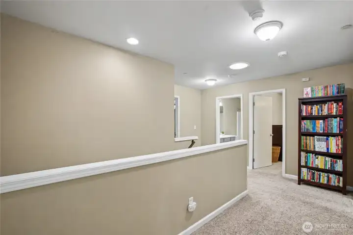 Hallway showing bedroom #3 and additional full bathroom