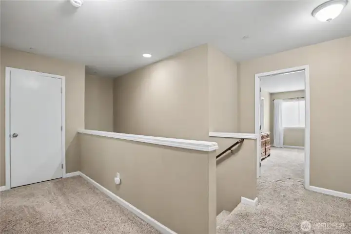 hallway connecting all bedrooms, showing the Primary Suite