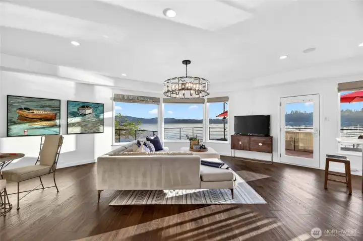Light-filled and lake-facing, the lower den/guest quarters are designed to live as beautifully as the view it frames.