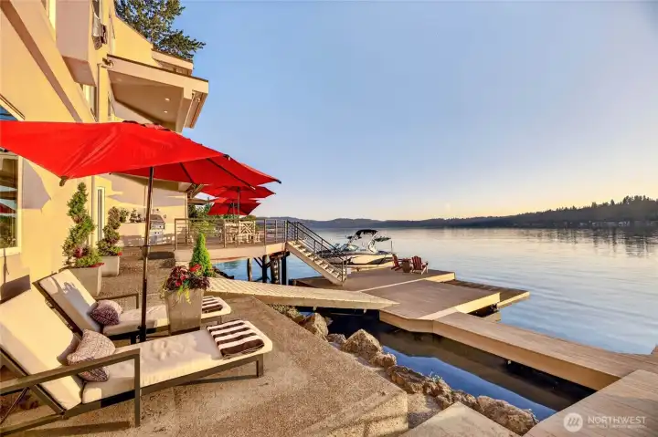 Sun-drenched lounging, multiple entertaining terraces, and direct dock access with boat lift — lakefront living at its most effortless.