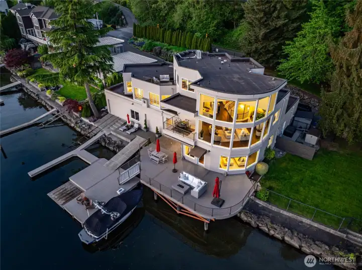 140 feet of prime lakefront and a level lawn made for lawn games and golden hour gatherings.