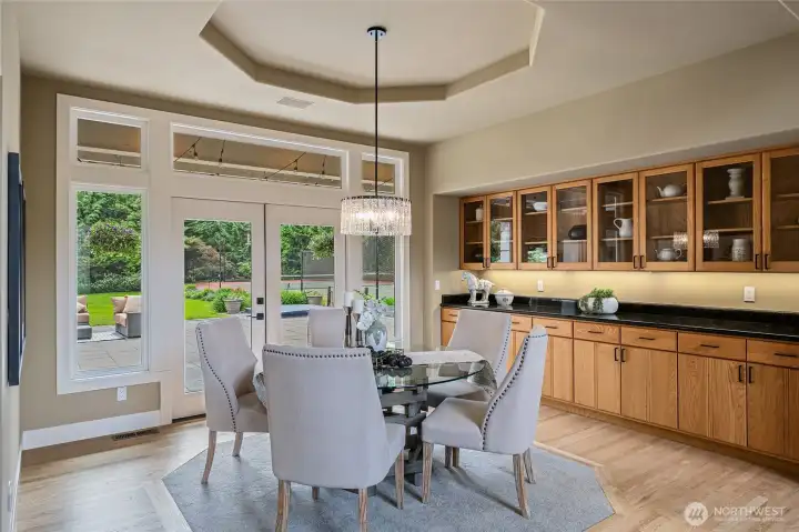 Formal Dining Room with elegant modern lighting and stunning build in hutch.