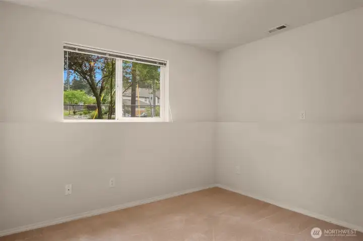 Lower level bedroom with lots of natural light.