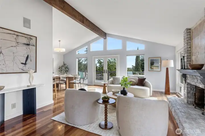 large windows & vault ceilings fill the space w/ abundant natural light