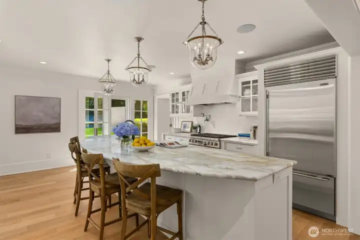 Well-appointed kitchen centered around a generous island. Well-appointed kitchen centered around a generous island.