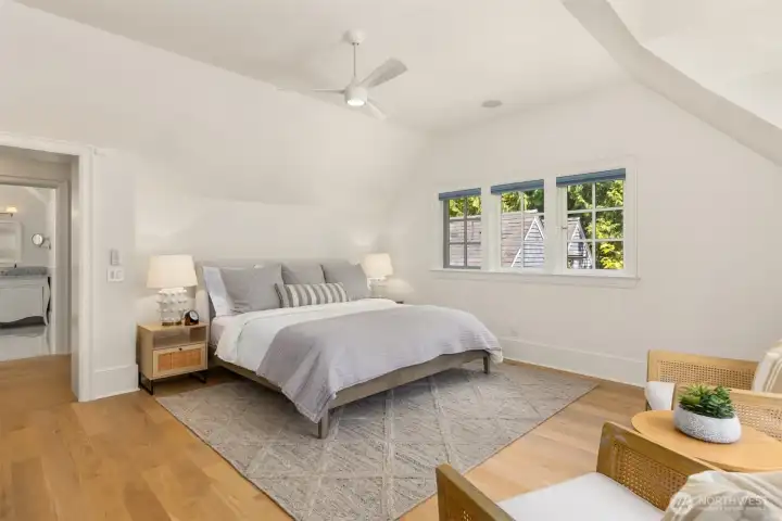 Spacious bedroom featuring vaulted ceilings and an en-suite bathroom. Spacious bedroom featuring vaulted ceilings and an en-suite bathroom.